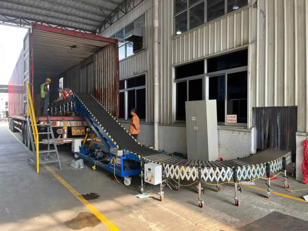 NAILI loading conveyor setup connecting an expandable roller conveyor to an inclined belt conveyor